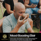 A man enjoying a traditional grind Kava from a bowl surrounded by others in a relaxed outdoor setting. Product: Sample Pack - Premium Tongan, Vanuatu, and Fiji Kava from Koa Kava.