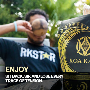 Relaxing outdoors with a cool drink in hand, embraced by the calmness of nature, using a Koa Kava Traditional Kava Strainer Bag with Drawstring for traditional kava brewing.