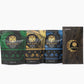 Four elegantly designed packages of Sample Pack - Premium Tongan, Vanuatu, and Fiji Kava by Koa Kava displayed in a row against a white background, showcasing a variety of flavor options with visually appealing patterns and branding.